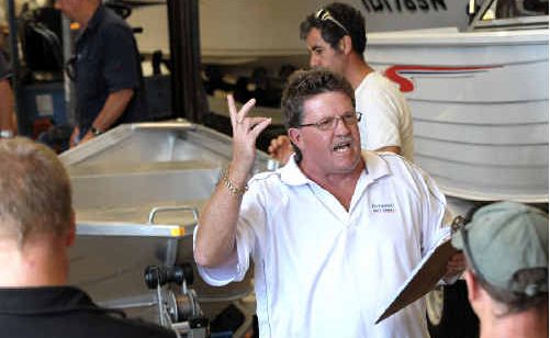 Glenn Aylward from Aylward Auctioneers with boats up for auction after a company went bust. Glenn Aylward from Aylward Auctioneers with boats up for auction after a company went bust.